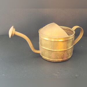 Antique bronze watering can